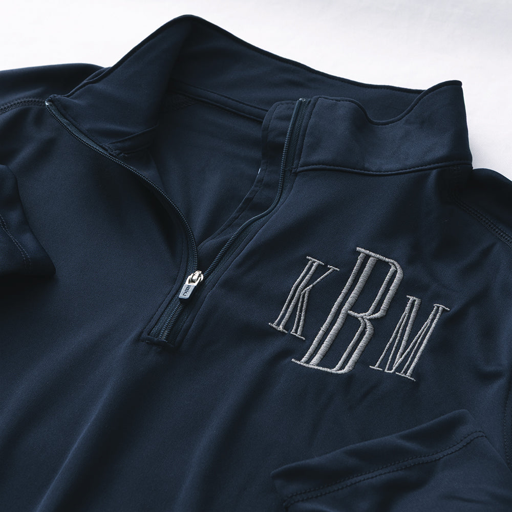 close up of navy and grey monogrammed quarter zip pullover 