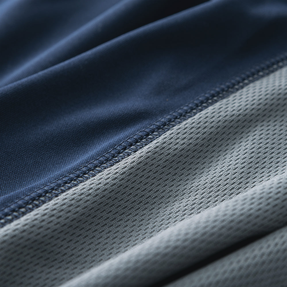 close up of navy and grey quarter zip pullover fabric 