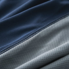 close up of navy and grey quarter zip pullover fabric 