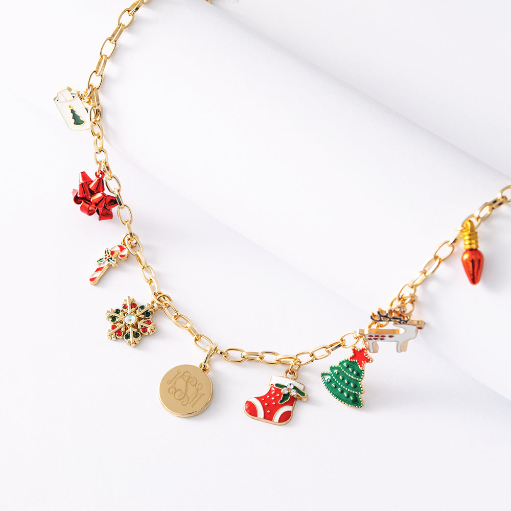 close up of monogrammed christmas charm necklace in red and green 