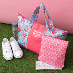 coral botanical packable weekend duffel on grass