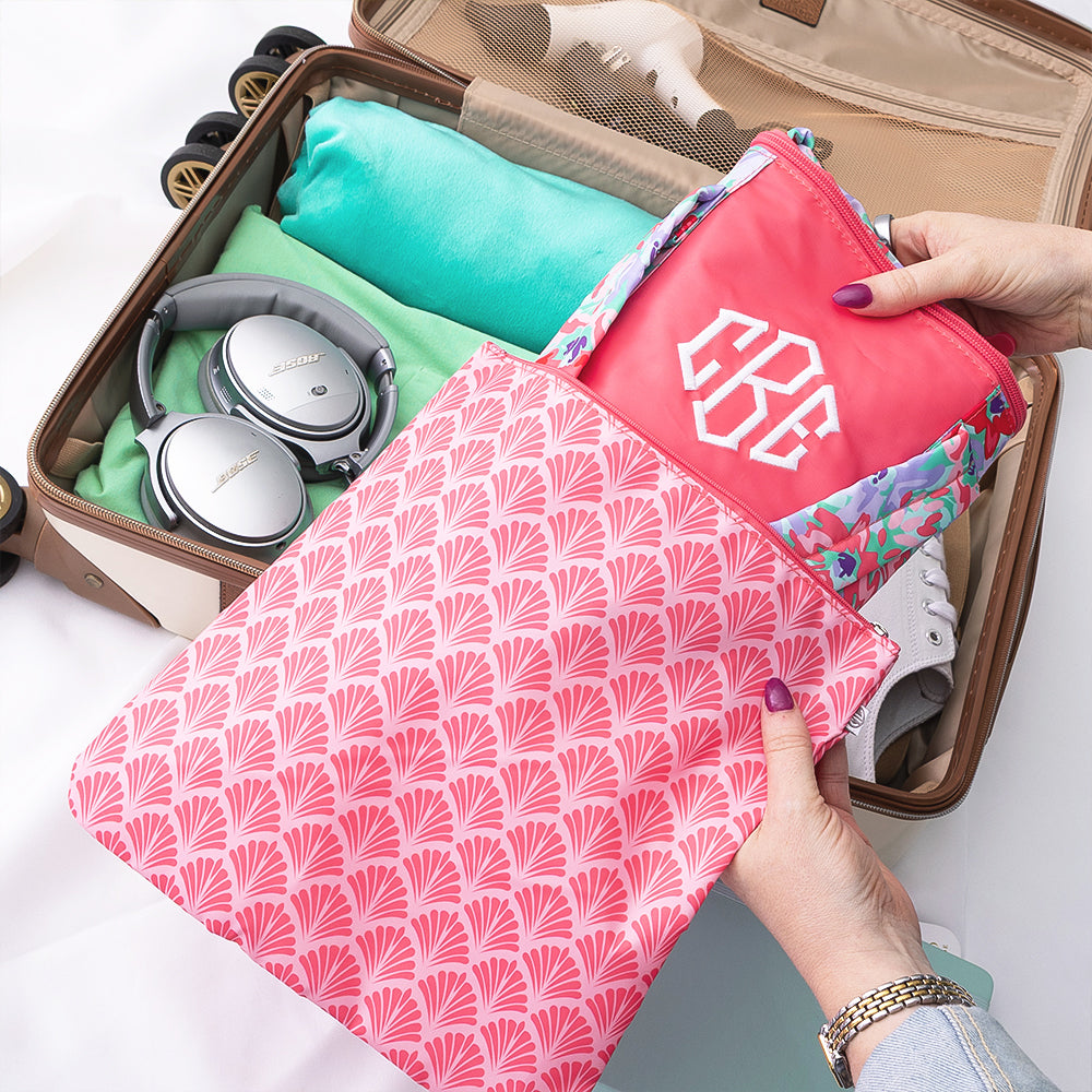 coral botanical packable weekend duffel packed into suitcase 