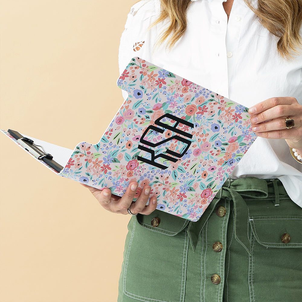 coral floral clipboard held by woman