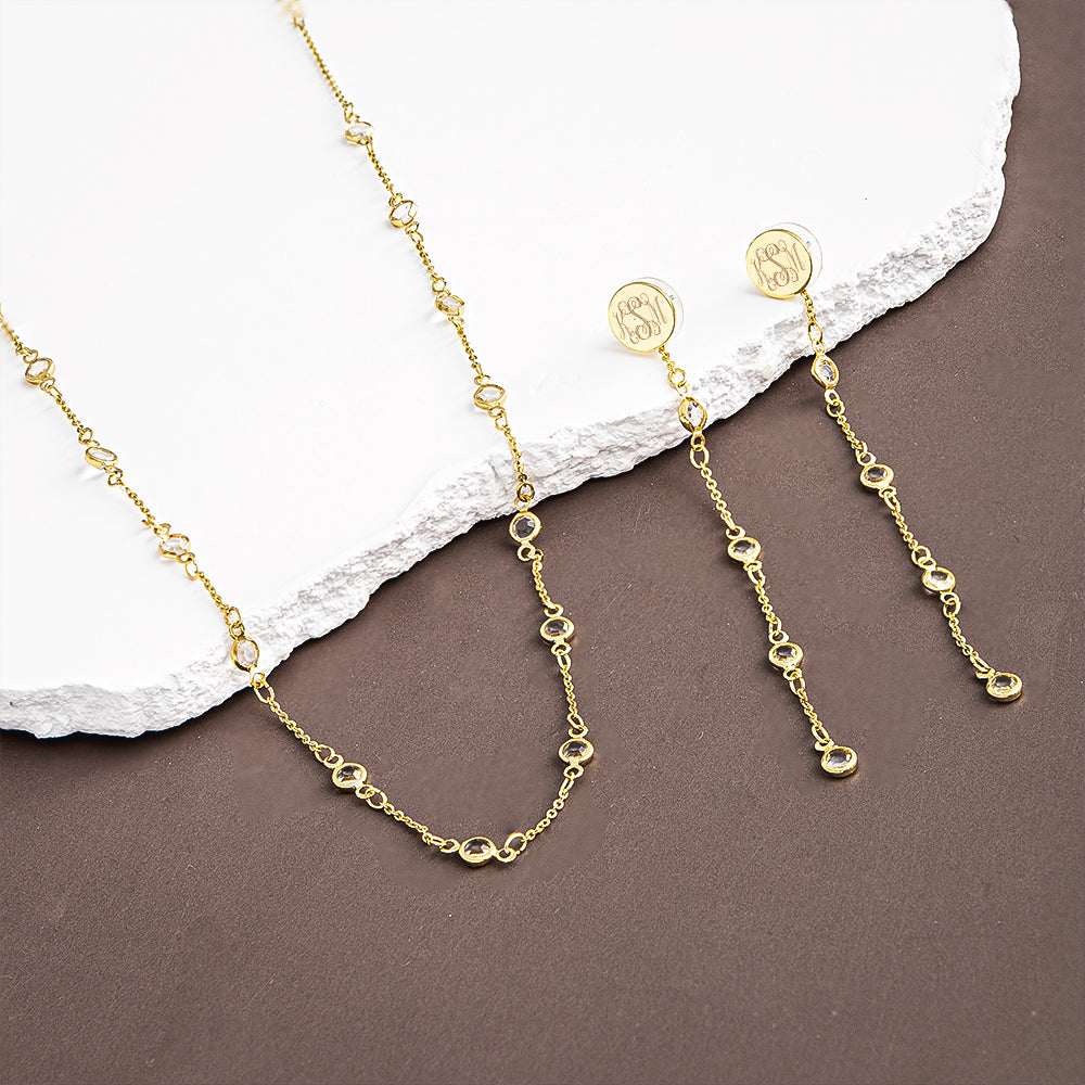 crystal duster earrings and necklace on brown