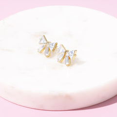 crystal bow earrings on marble