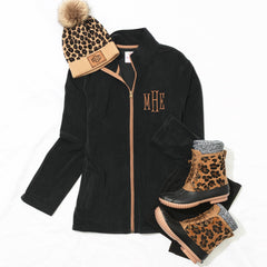 black fleece jacket flatlay