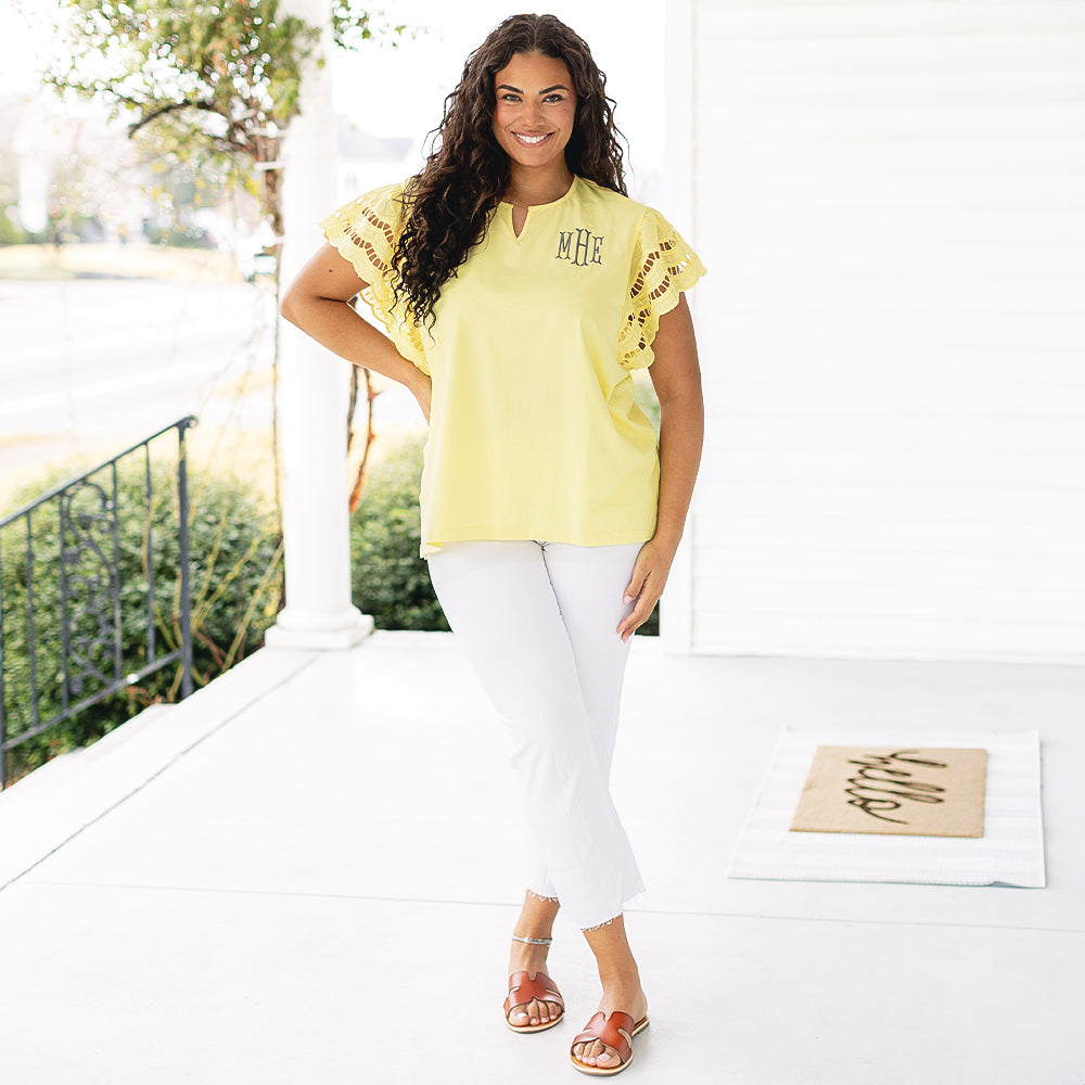 [julia-ann] girl wearing monogrammed flutter sleeve top in soft yellow with white pants