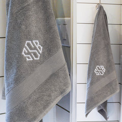 monogrammed bath towel in grey hanging and close up