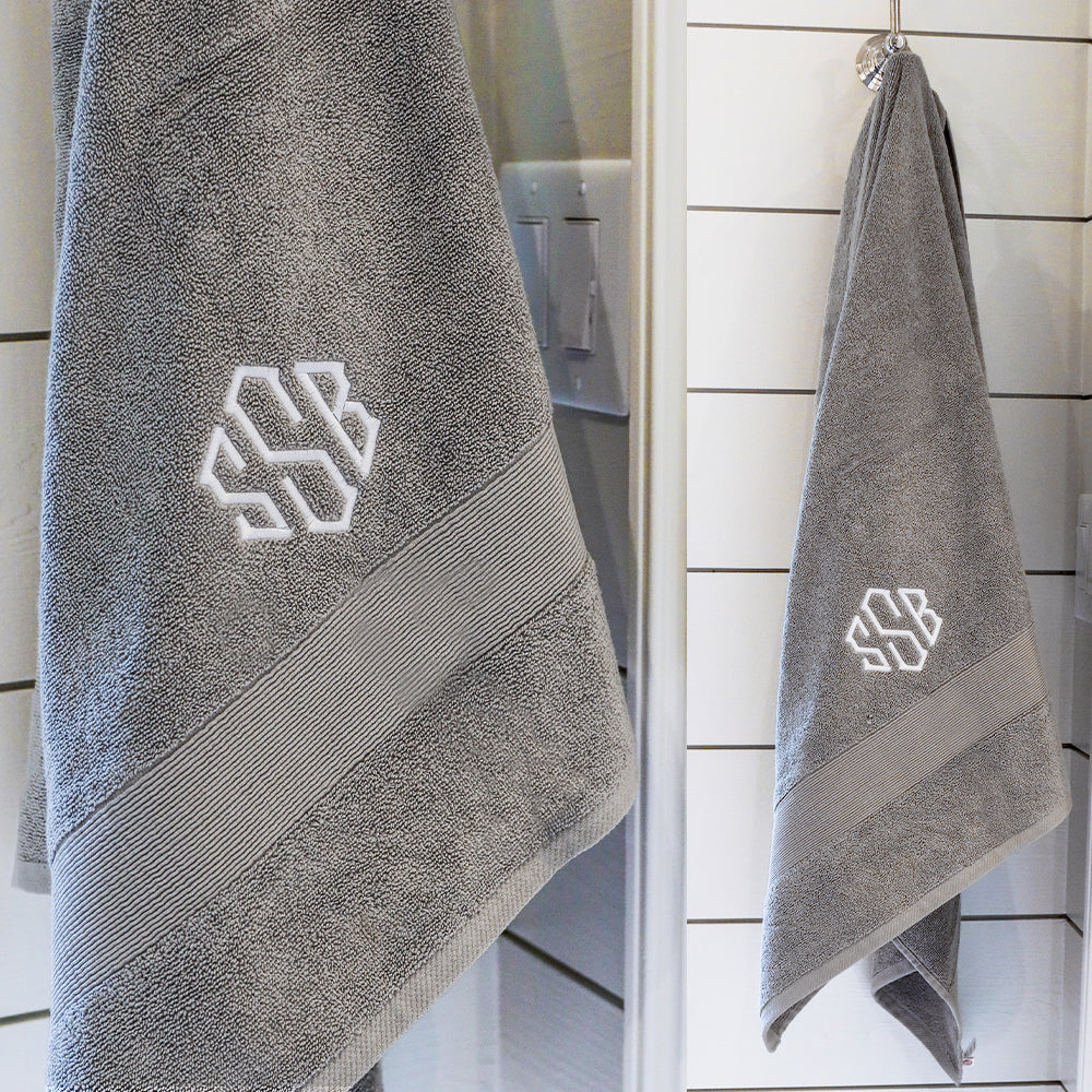 monogrammed bath towel in grey hanging and close up
