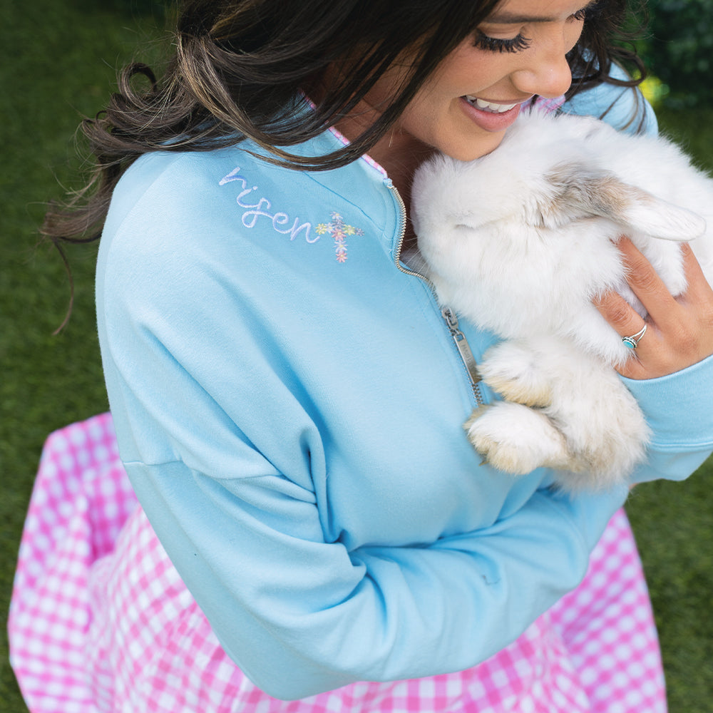 [Peyton] close up of girl wearing risen easter blue faith pullover with bunny