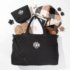 diamond weekender and cosmetic case in black with clogs and shacket