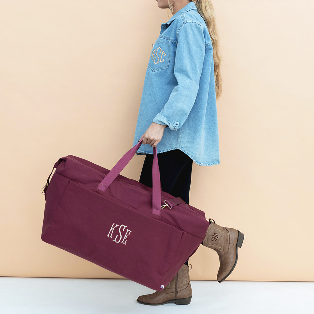 burgundy woodland blossom foldover weekend bag in hand