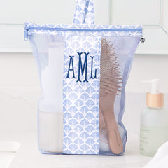 blue shells monogrammed shower bag on bathroom counter