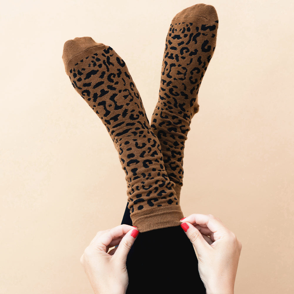 dark leopard socks on feet