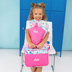 flower power basic backpack and lunchbox held by sitting girl 