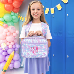 girl carrying monogrammed lunch box with matching backpack