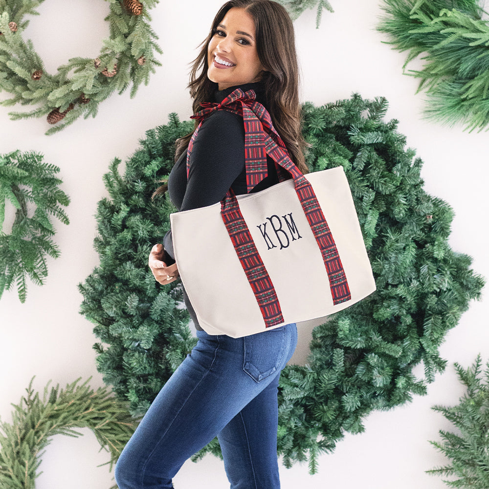 girl carrying monogrammed plaid tote in red plaid 