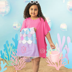 girl holding mermaid kids monogrammed beach towel with scallop cover up