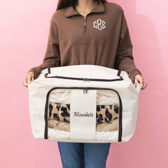 girl holding monogrammed storage bag in ivory 