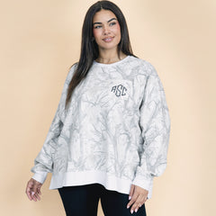 girl wearing birch camo oversized monogrammed sweatshirt with leggings