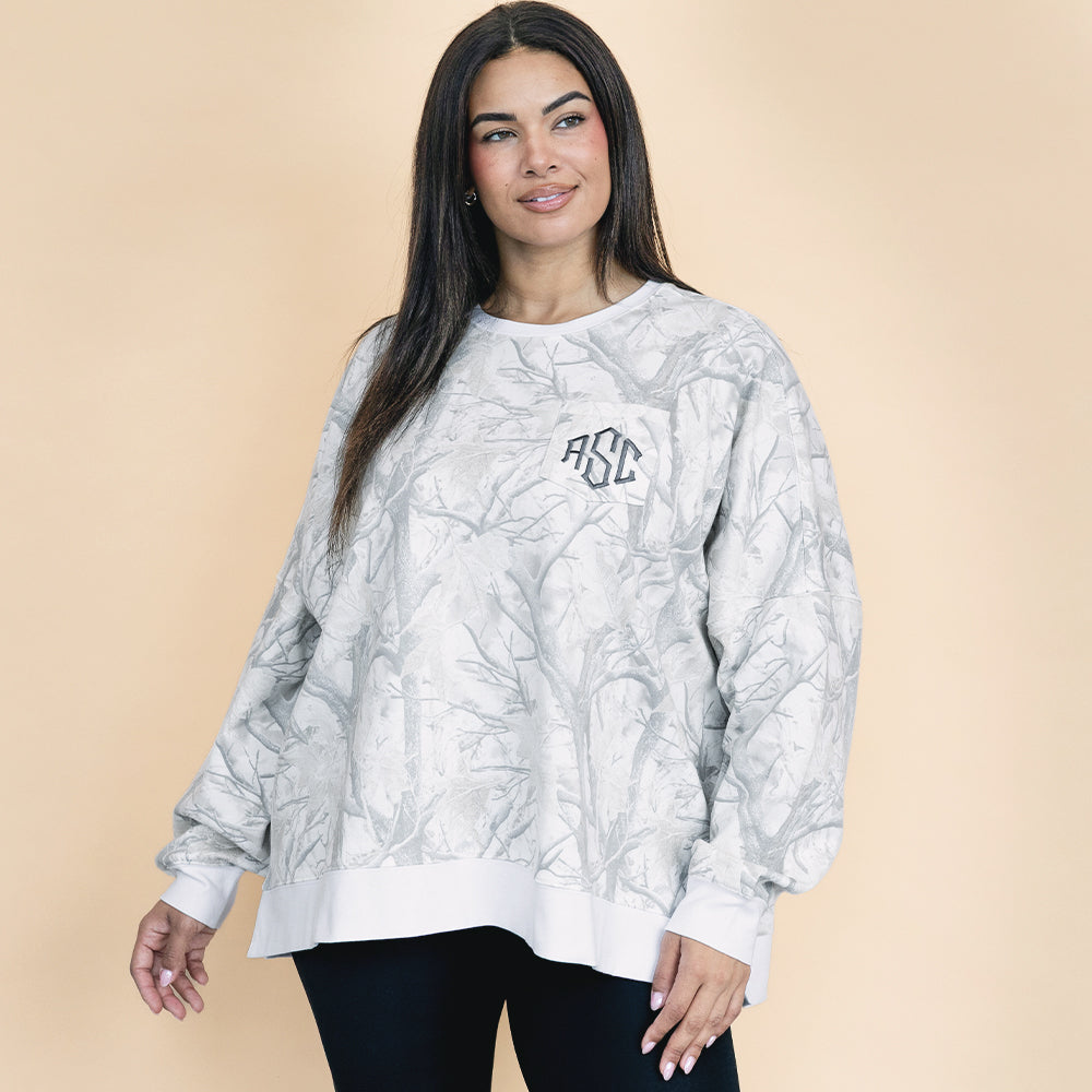 girl wearing birch camo oversized monogrammed sweatshirt with leggings