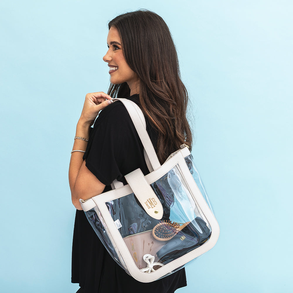 girl wearing bone clear stadium approved tote on shoulder