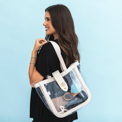 girl wearing bone clear stadium approved tote on shoulder