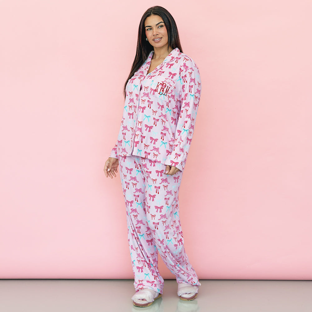 girl wearing christmas coquette personalized softspun pajama set with slippers
