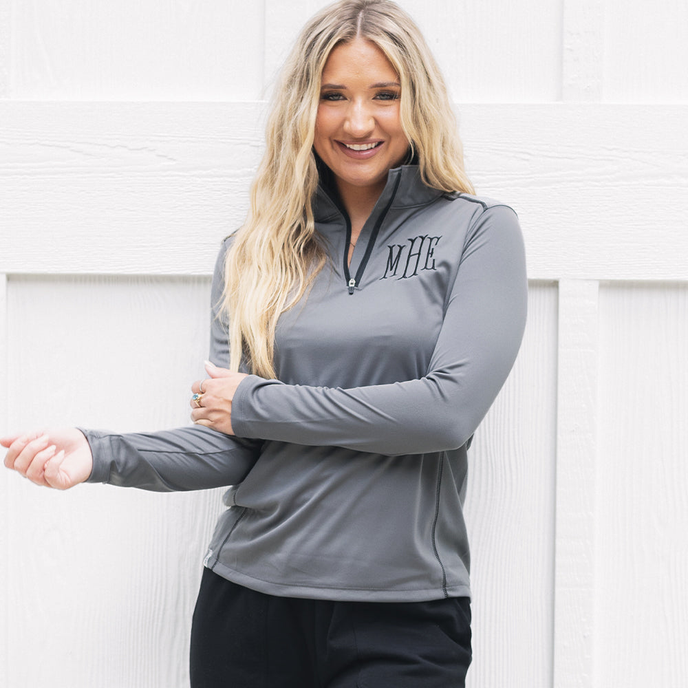 girl wearing grey monogrammed quarter zip pullover