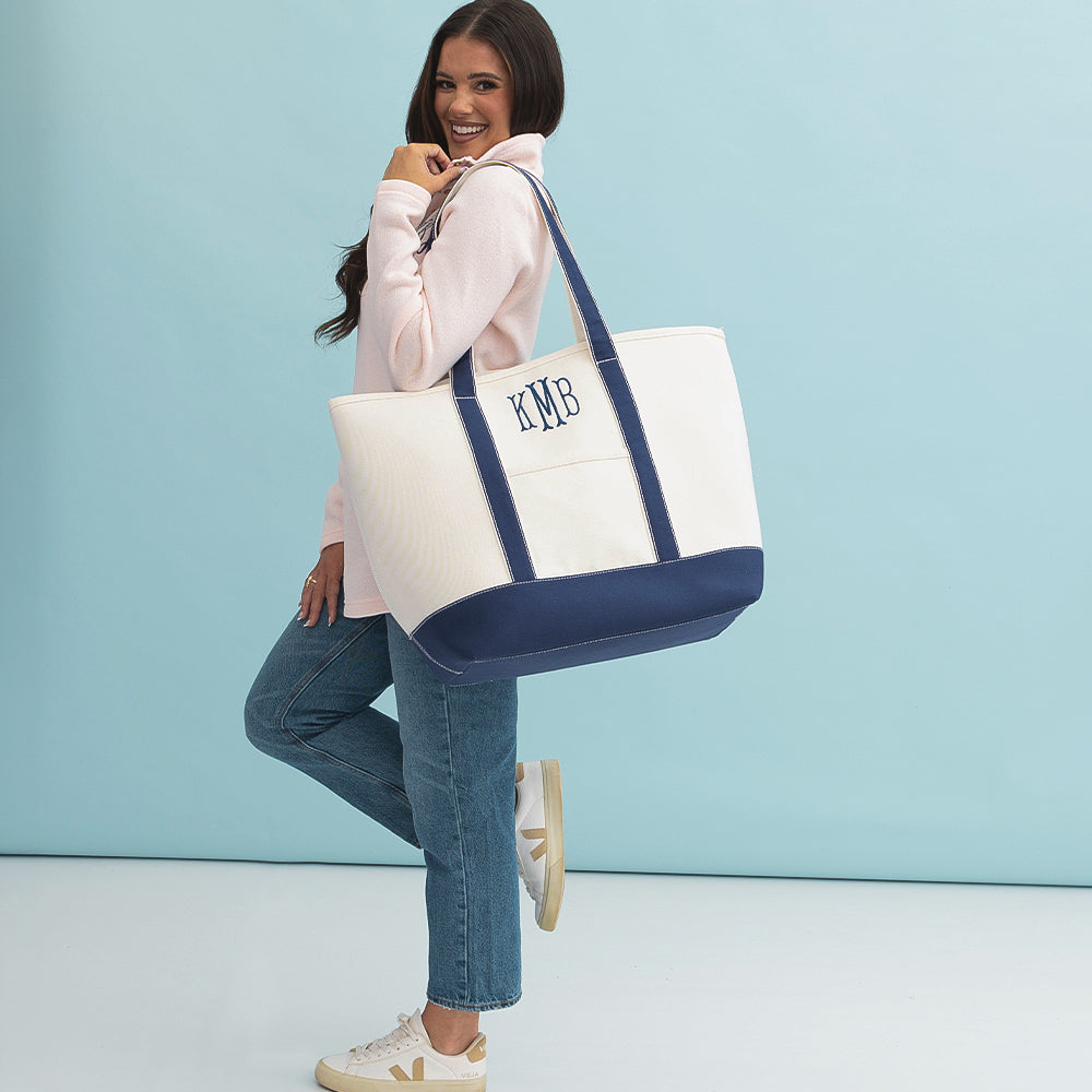 girl wearing large canvas tote on shoulder