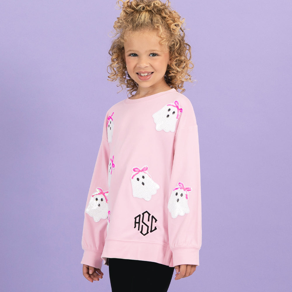 girl wearing light pink monogrammed kids sequin ghost sweatshirt 