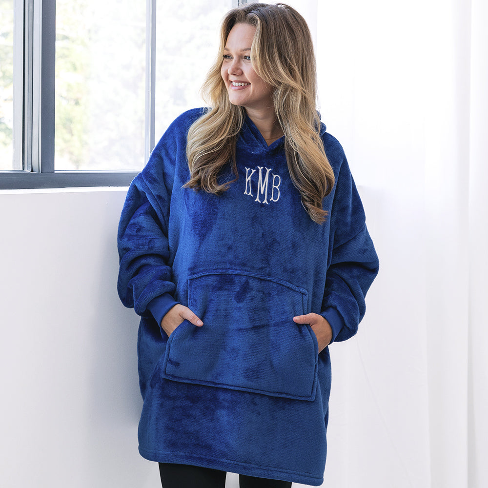 girl wearing monogrammed blue blanket hoodie with leggings 