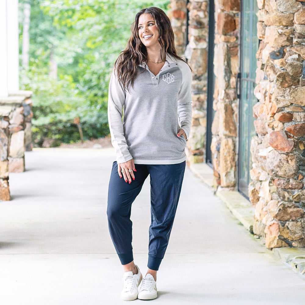 girl wearing monogrammed essential pullover in heathered grey with sneakers 