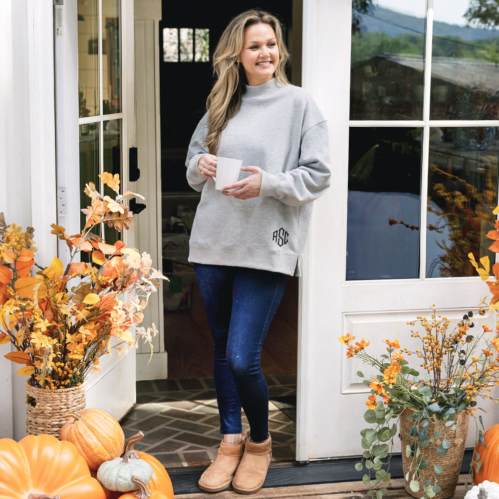 girl wearing monogrammed mockneck sweatshirt in heathered grey 