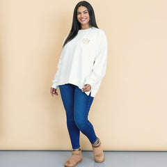 girl wearing monogrammed oversized sweatshirt in ivory with jeans and moccasins 