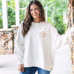 girl wearing monogrammed oversized sweatshirt in ivory 