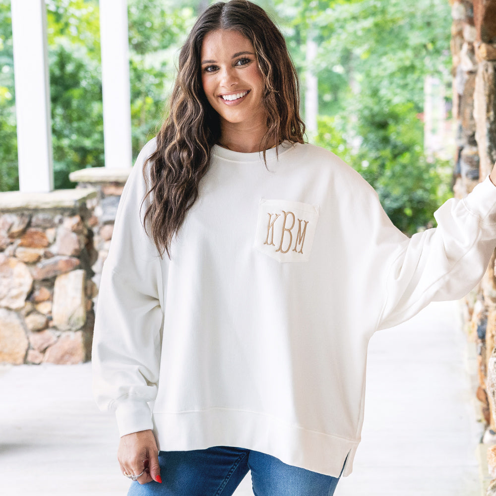 girl wearing monogrammed oversized sweatshirt in ivory 
