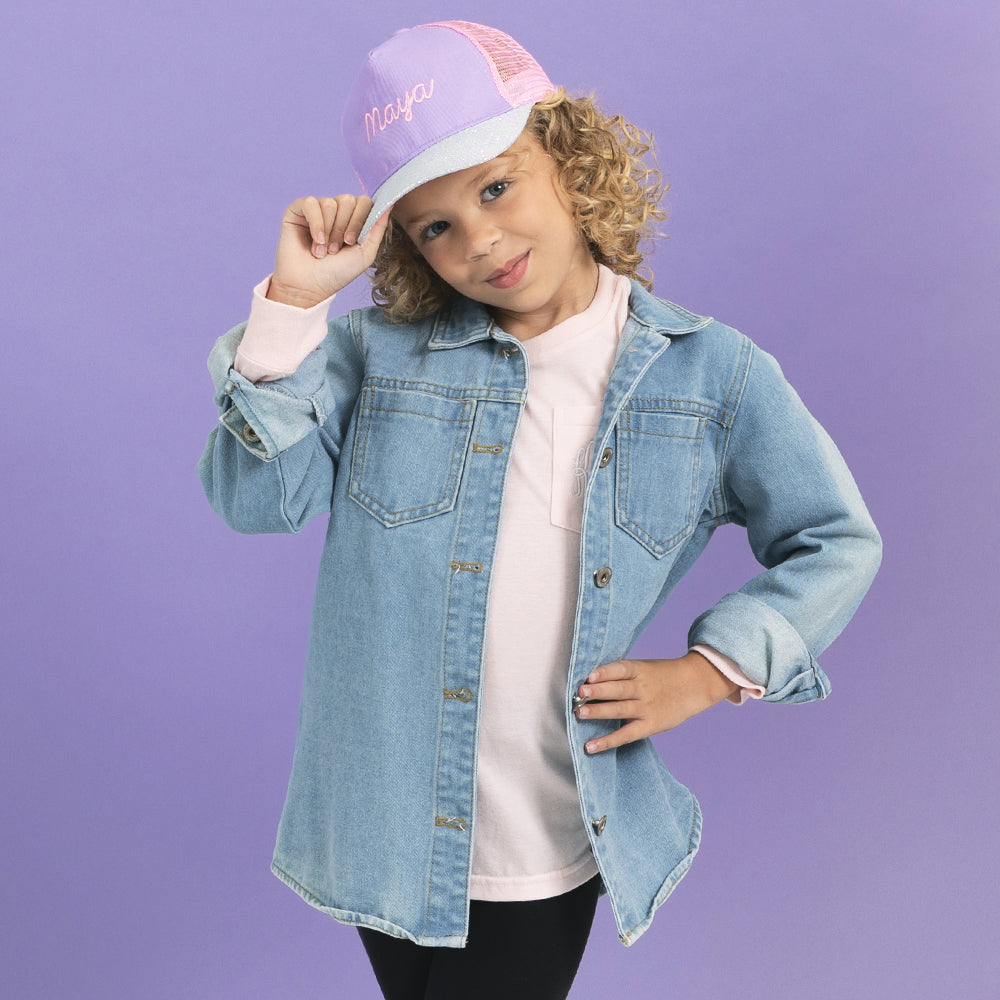 girl wearing monogrammed purple trucker hat 