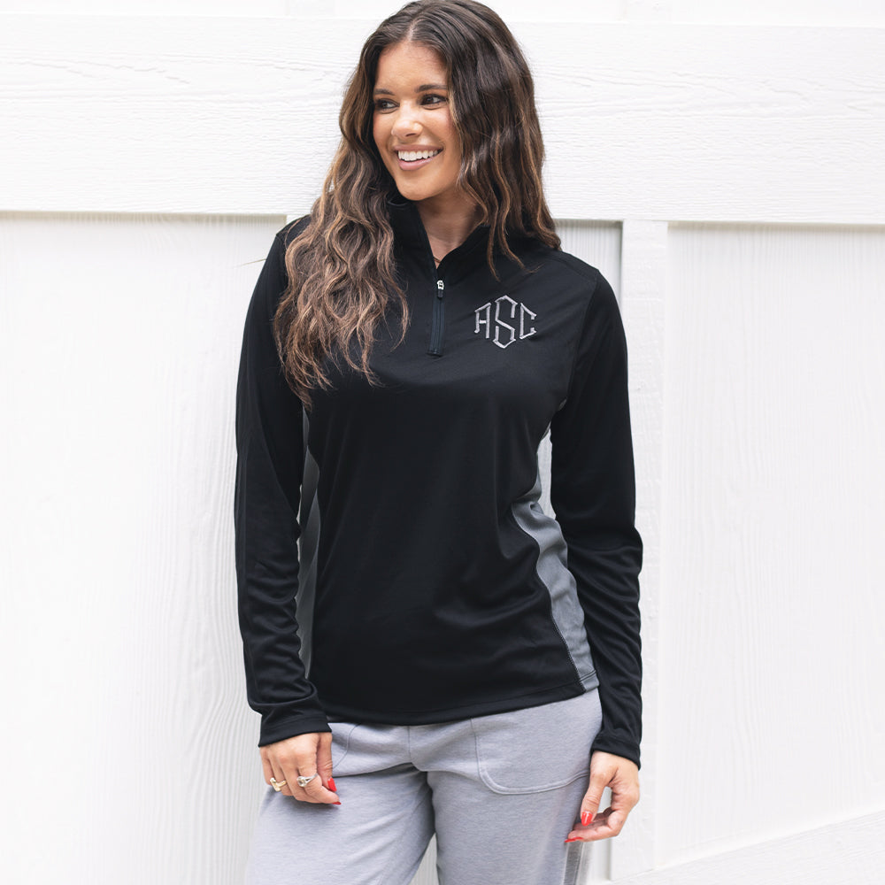 girl wearing monogrammed quarter zip pullover in black and grey 