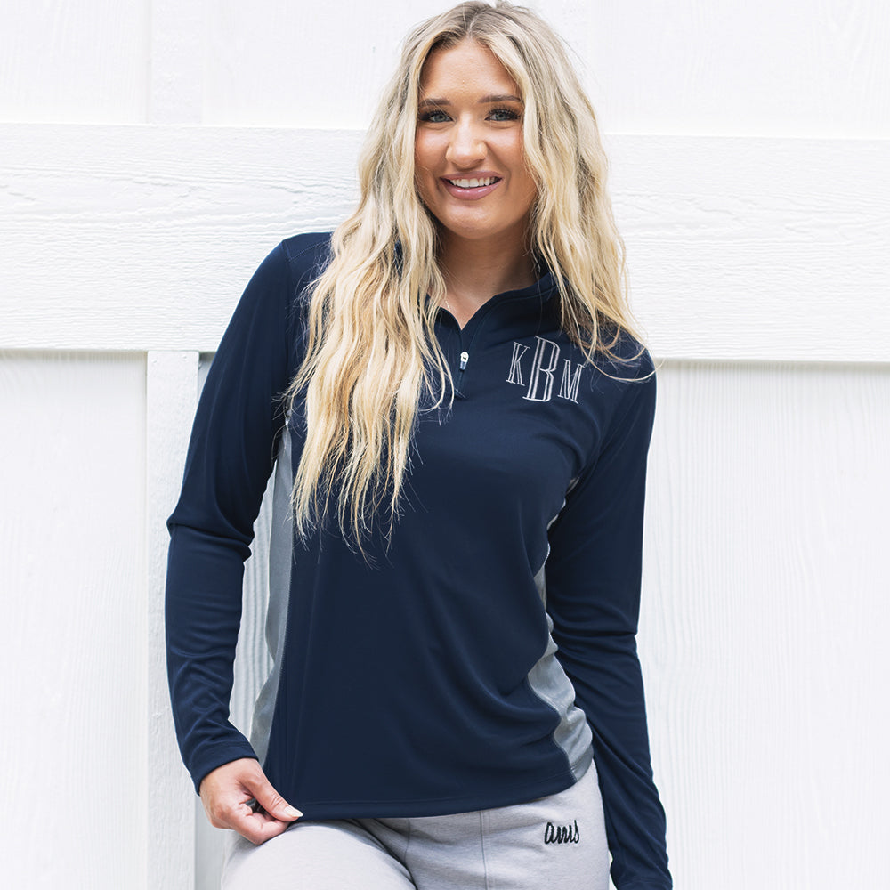 girl wearing monogrammed quarter zip pullover in navy and grey 