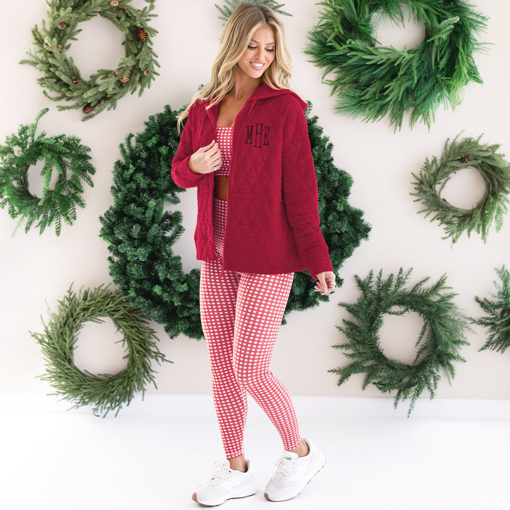 girl wearing monogrammed quilted red hoodie jacket with plaid athletic set