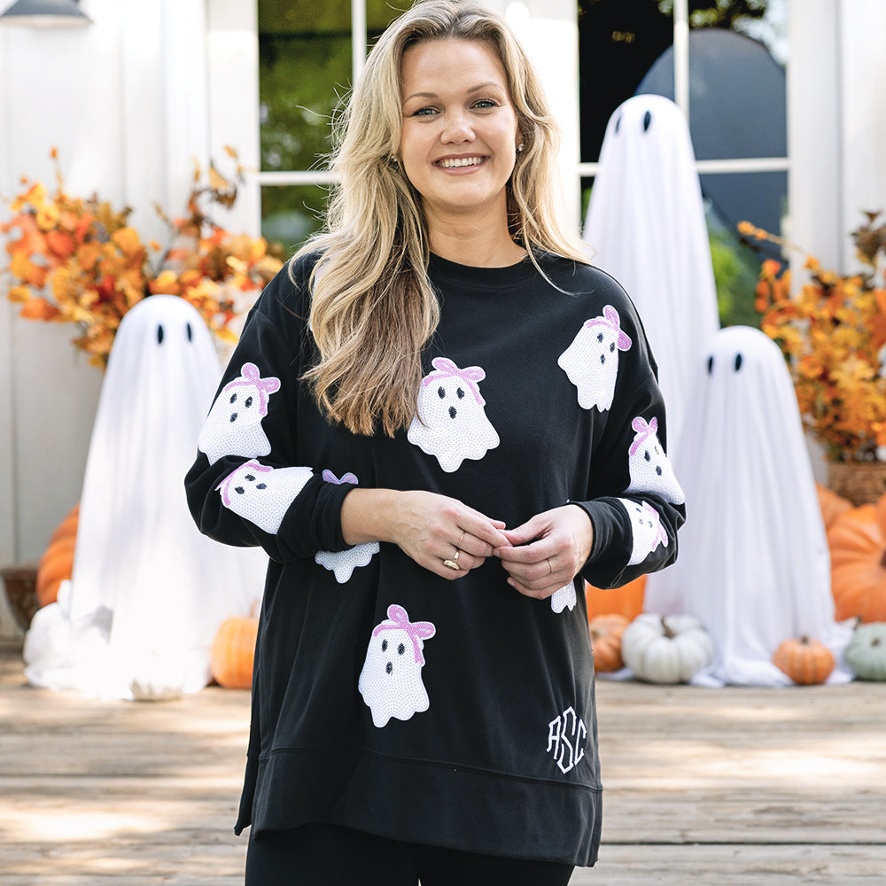 girl wearing monogrammed sequin ghost sweatshirt in black 