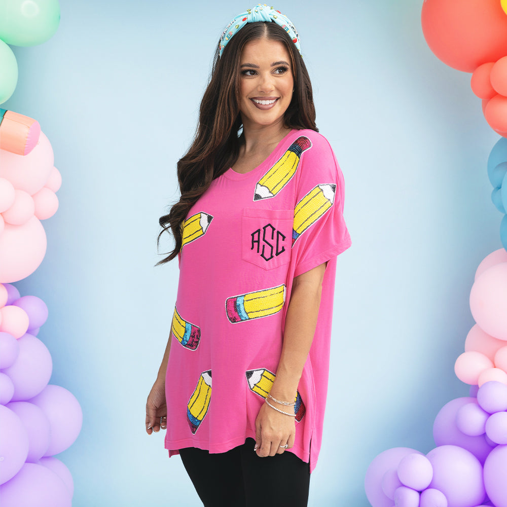 girl wearing monogrammed sequin teacher tee in hot pink 