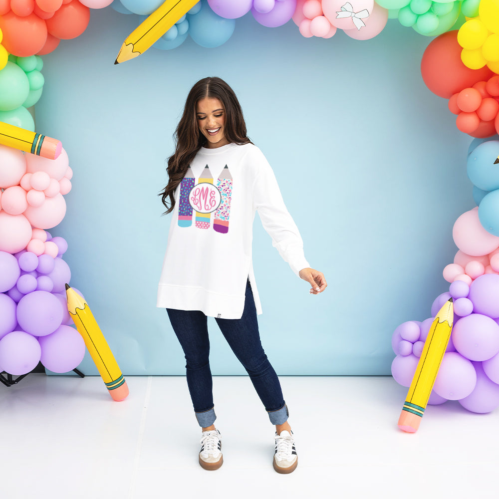 girl wearing monogrammed teacher sweatshirt