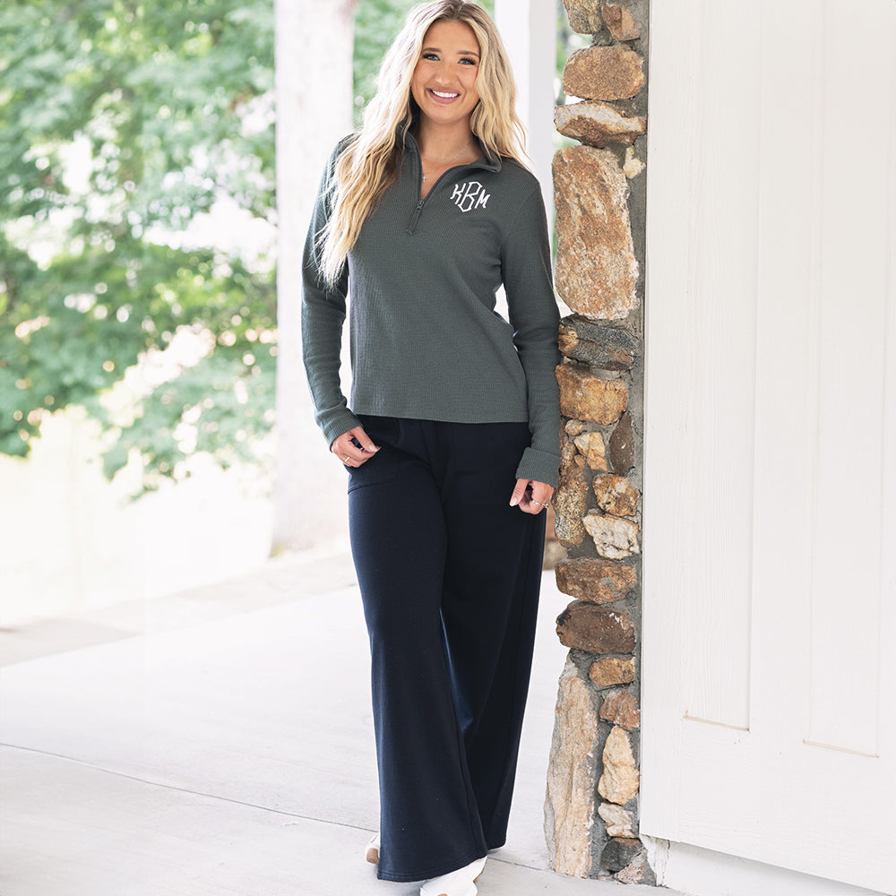 girl wearing monogrammed womens lightweight waffle quarter zip pullover in charcoal with black sweatpants 