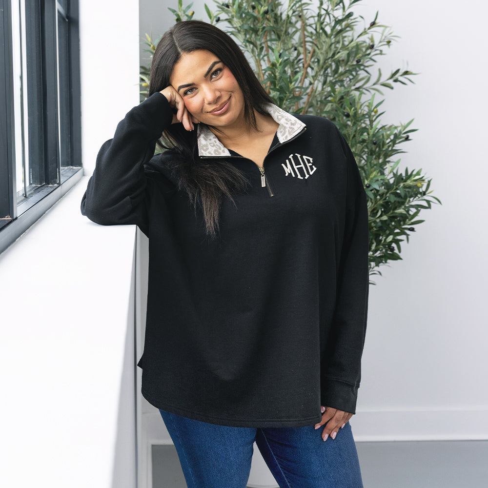 girl wearing personalized quarter zip sweatshirt in luxe leopard 