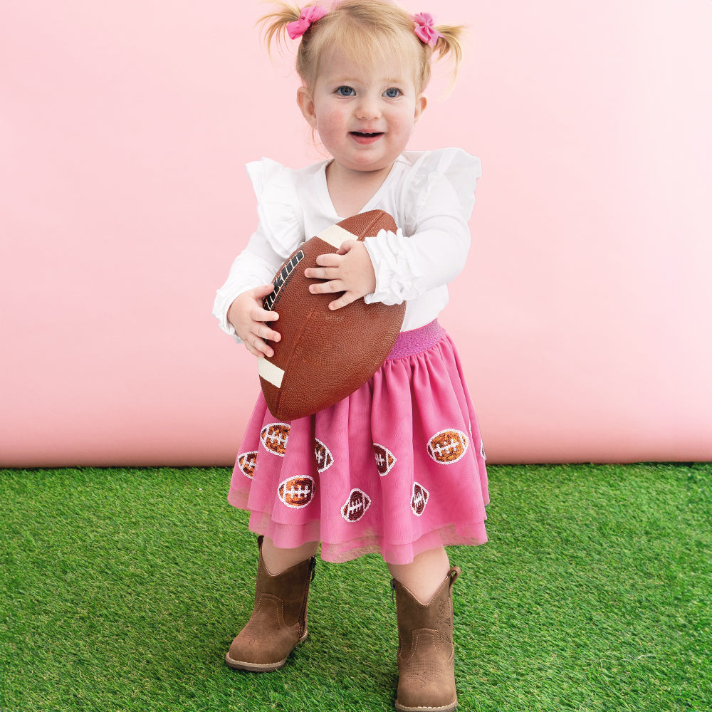 girl wearing pink sequin footballs tutu skirt 