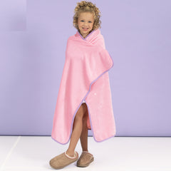 girl with personalized kids travel blanket wrapped around 