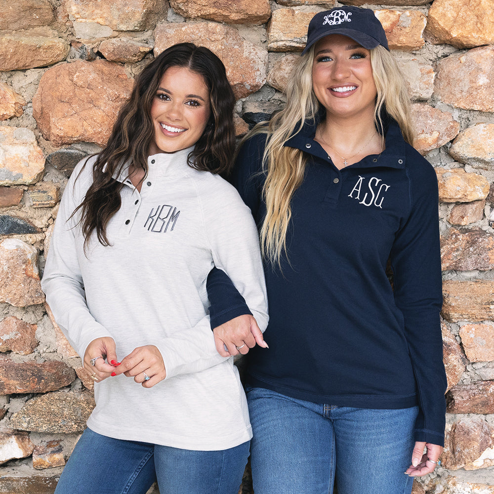girls wearing heathered ivory and navy essential pullovers 
