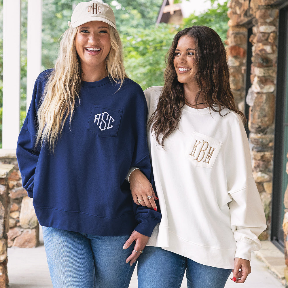 girls wearing monogrammed oversized sweatshirt in navy and ivory